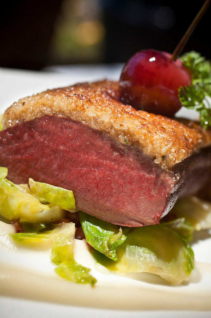 Saddle of Springbok with gratinated nut crust, glazed Brusselssprouts and cherry chocolate jus, Restaurant Bosmans at Grande Roche Hotel, Paarl, Cape Town, Western Cape, South Africa, RSA, Africa