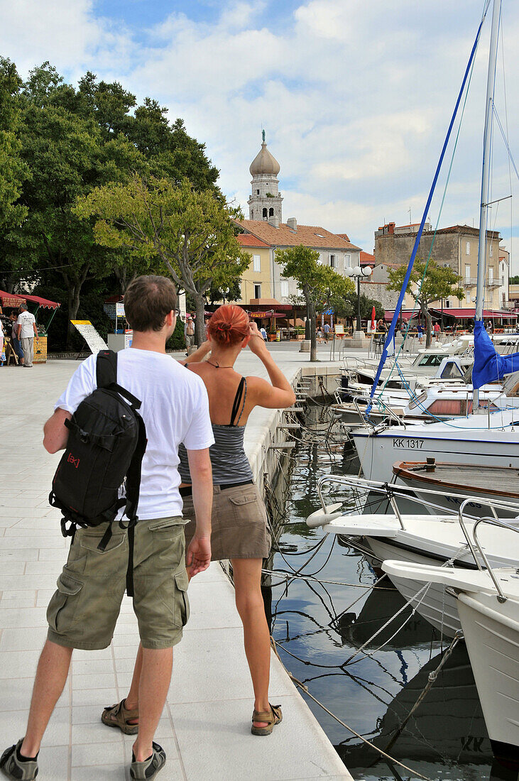 Tourists in the harbour of Krk town, Krk Island, Kvarnen Gulf, Croatia