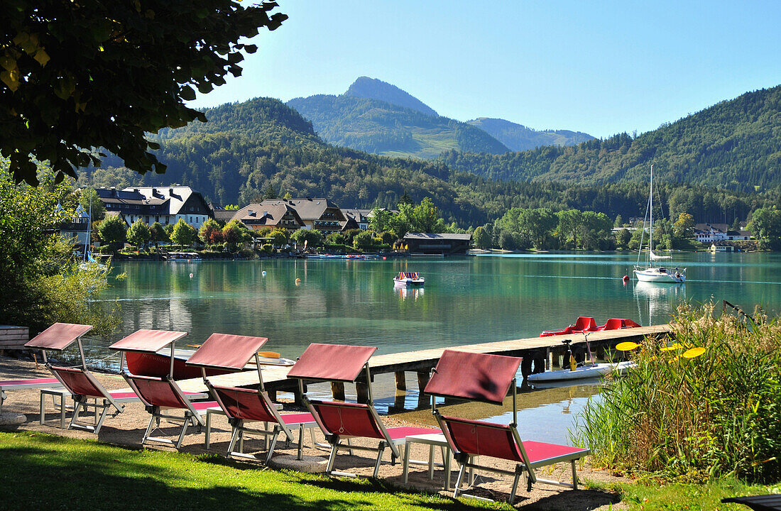 Deck chairs on the lake shore of lake Fuschl, Fuschl, Salzburg-land, Austria