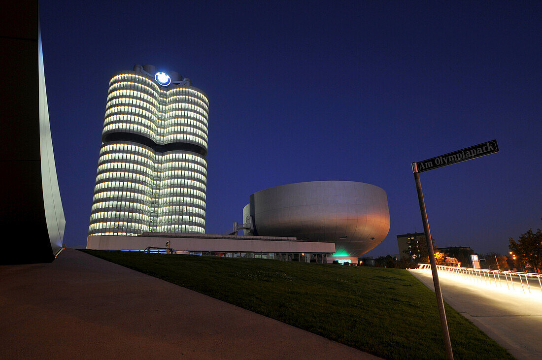 BMW four cylinder headquarters at the Olympiapark at night, Munich, Germany