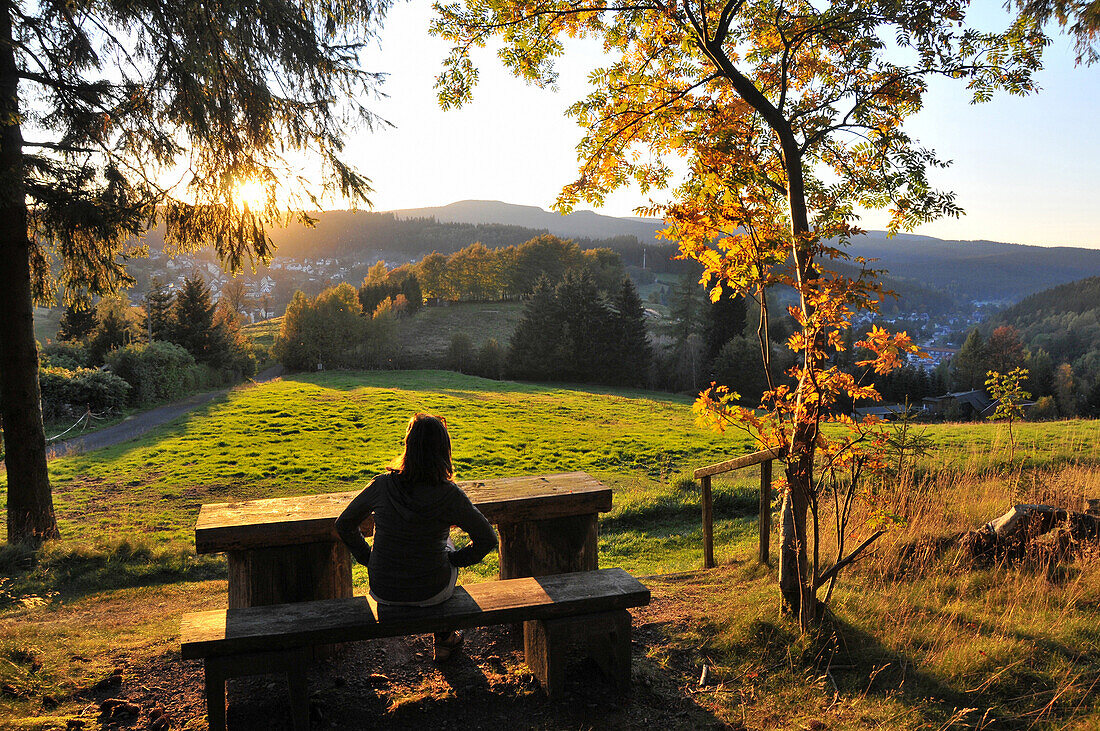 Woman enjoying the view along the Goethe and Rennsteig trail, near Stuetzerbach, Thuringian Forest, Thuringia, Germany