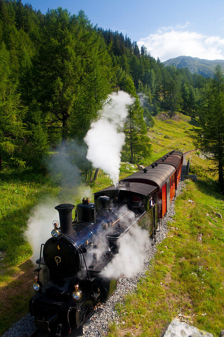 Steam train and steam lokomotive of Furka steam mountain railway, Wallis, Valais, Switzerland