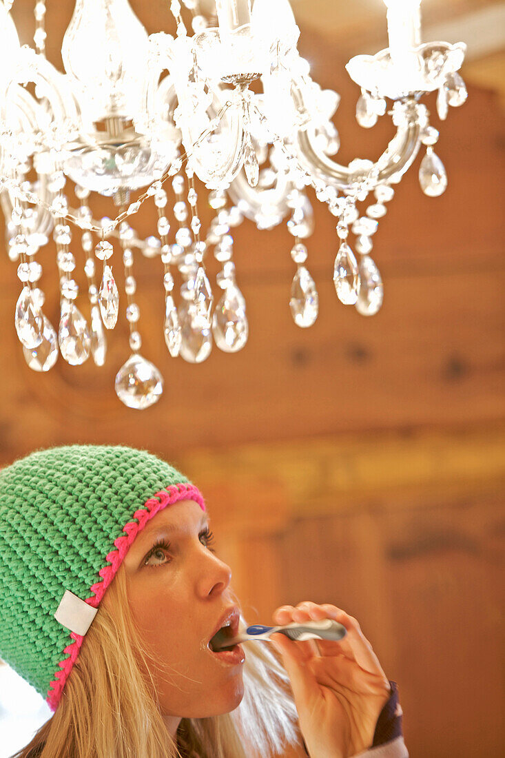 Young woman brushing her teeth