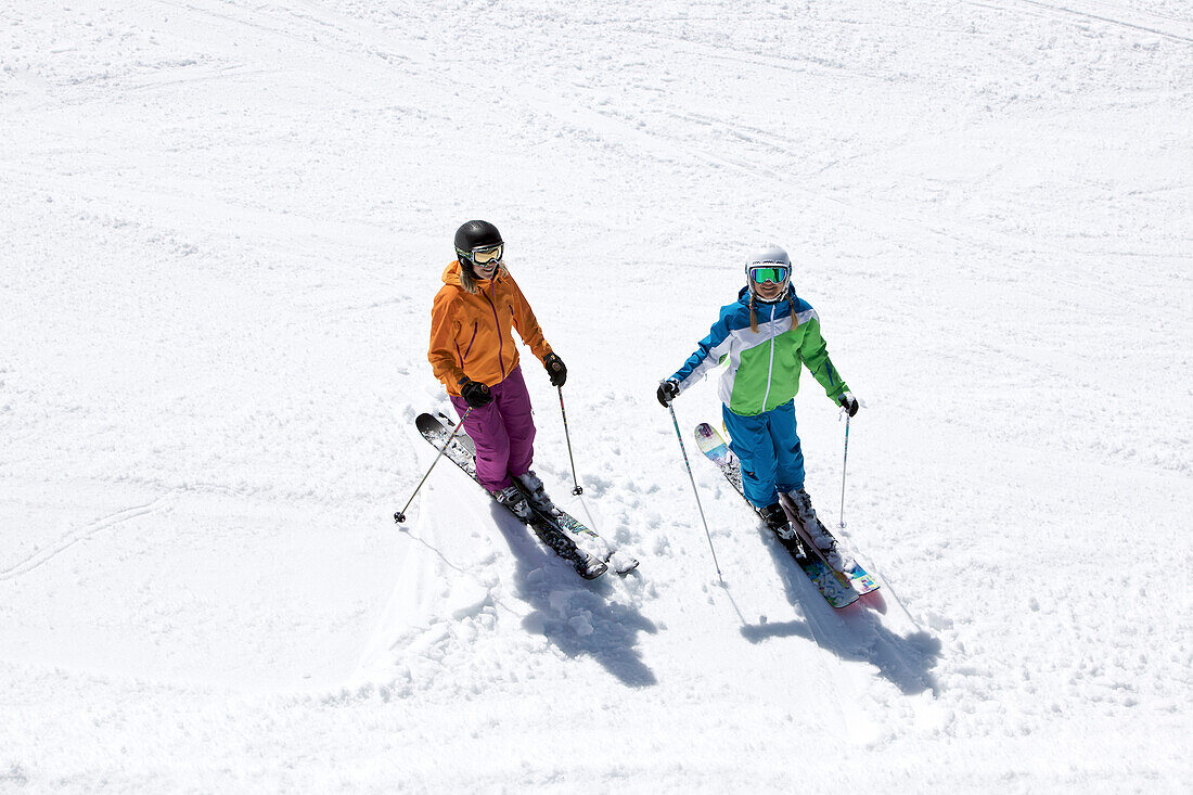 Two young female skiers on a slope, See, Tyrol, Austria