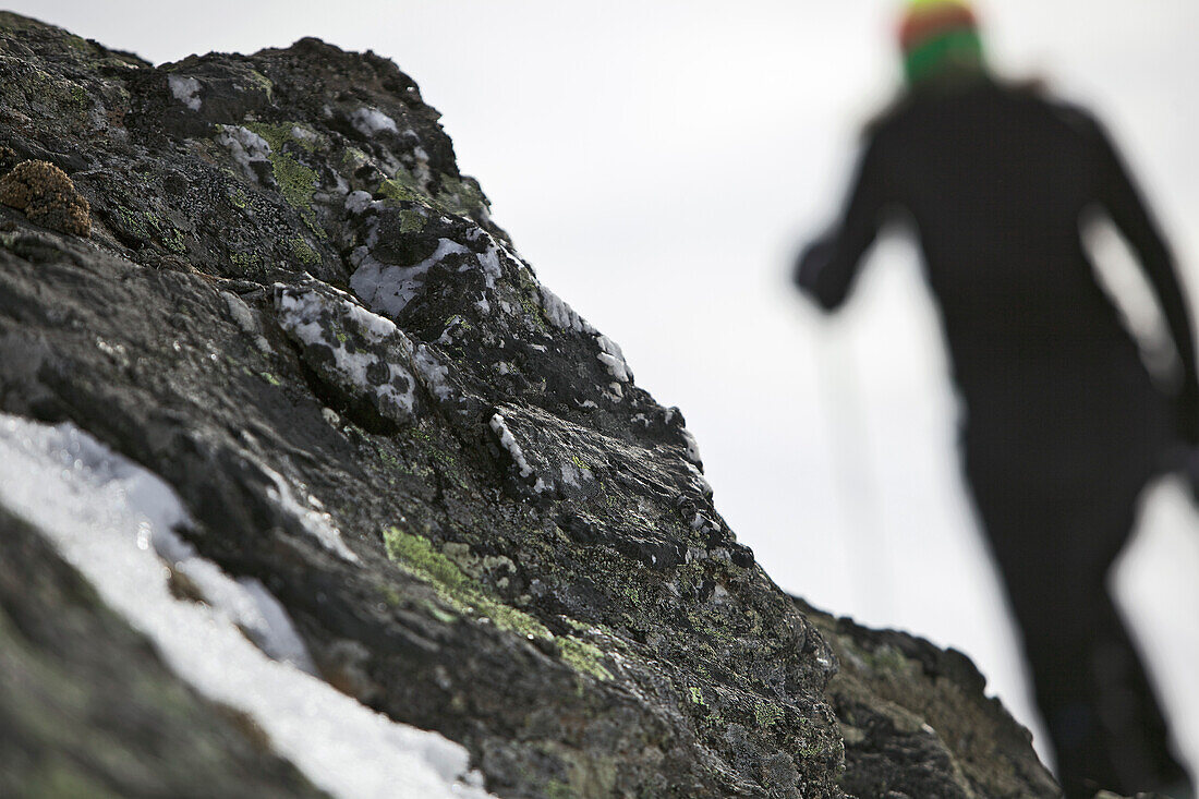 Young woman hiking up the mountain with snowshoes, See, Tyrol, Austria