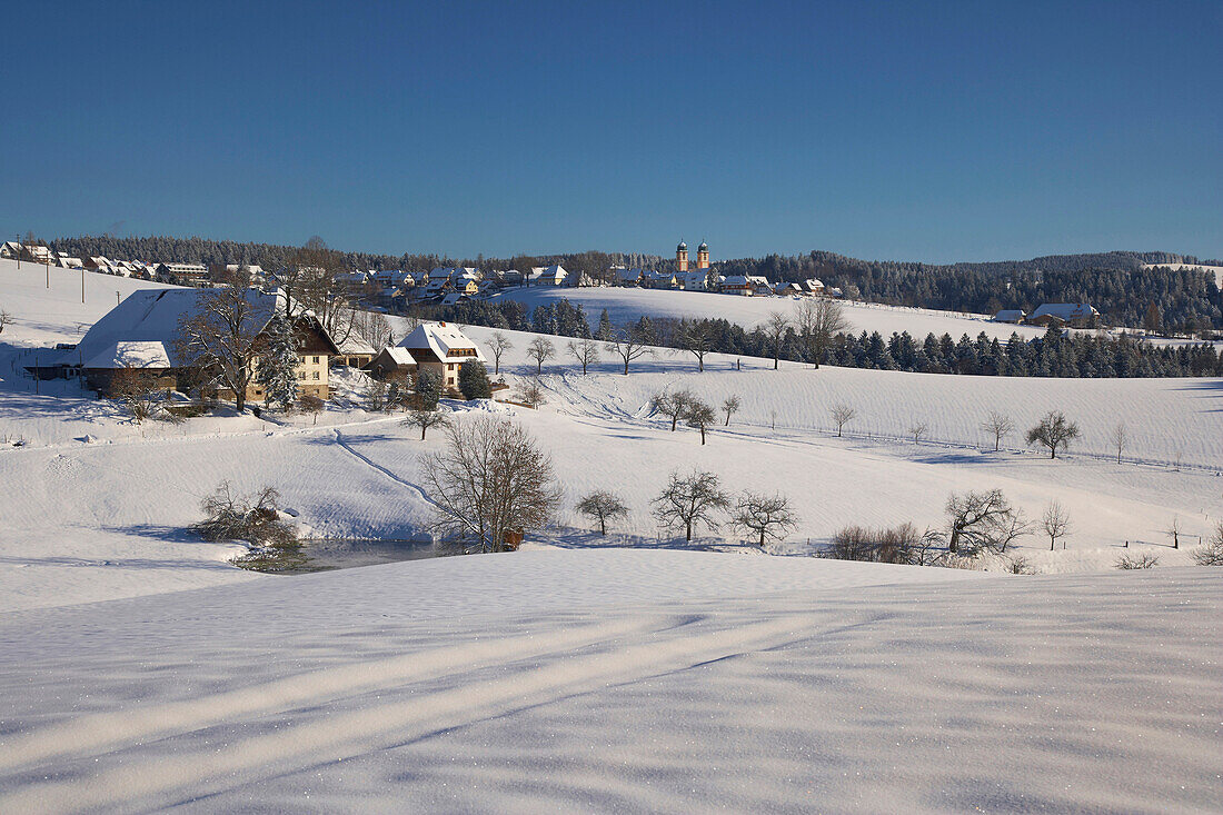 Farmhouse near St Maergen and the village of St Maergen on a winters day, Black Forest, Baden-Wuerttemberg, Germany, Europe