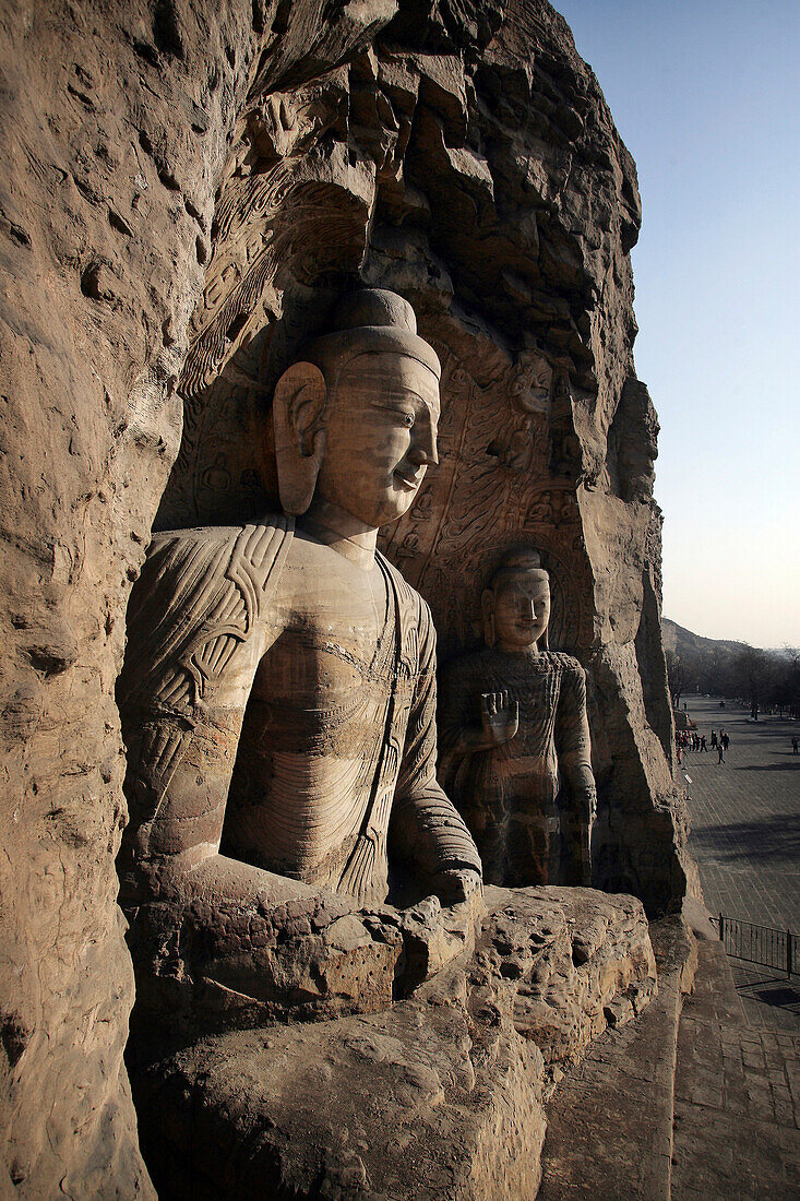 Statues at ancient Buddhist temple grotto, Buddhist statues at Yungang Caves (Grottoes/Shiku), located at the base of the Wuzhou Shan Mountains near Datong, Shanxi, China.