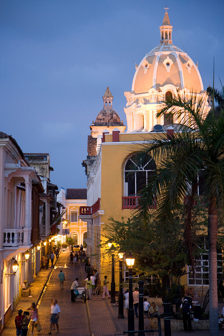 View of Cartagena after sunset with dome of San Pedro Claver in background, Cartagena, Colombia