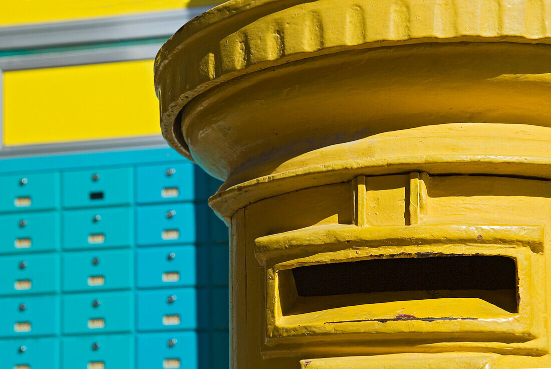 Yellow post box and turquoise PO boxes, Cyprus