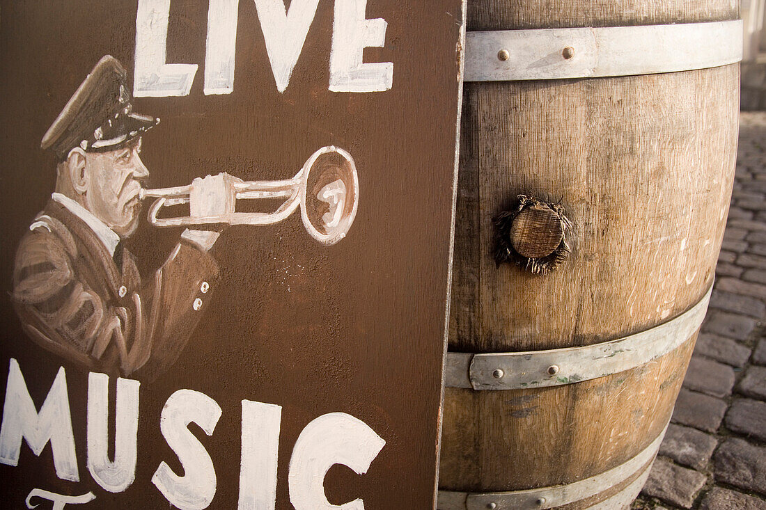 Sign for live music next to barrel, Nyhavn, Copenhagen, Denmark