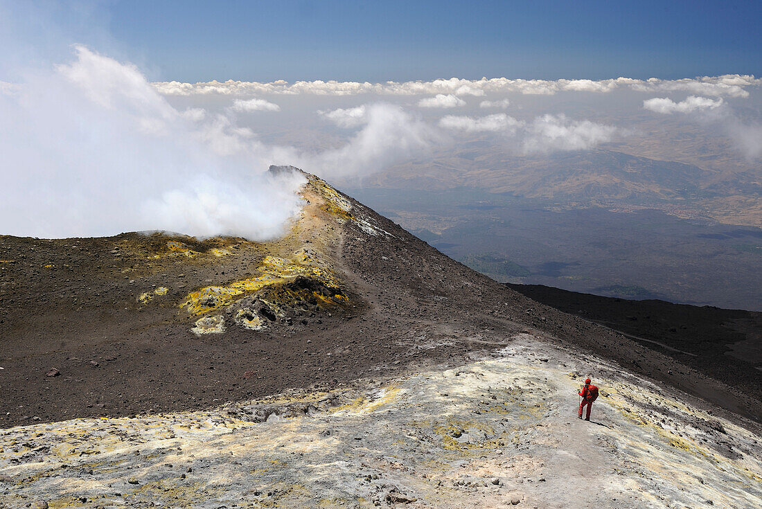 Italy, Sicily, Etna volcano woman standing on the brim of the main crater