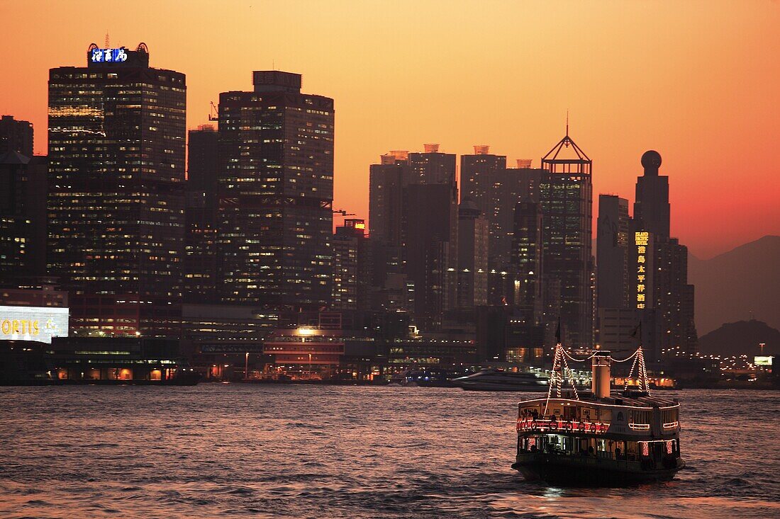 China, Hong Kong, Sheung Wan district skyline at dusk, harbour