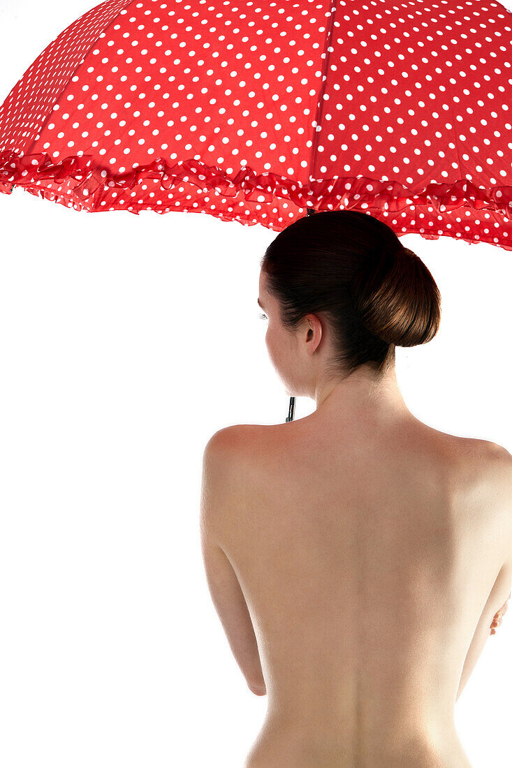 Woman from back, holding sunshade
