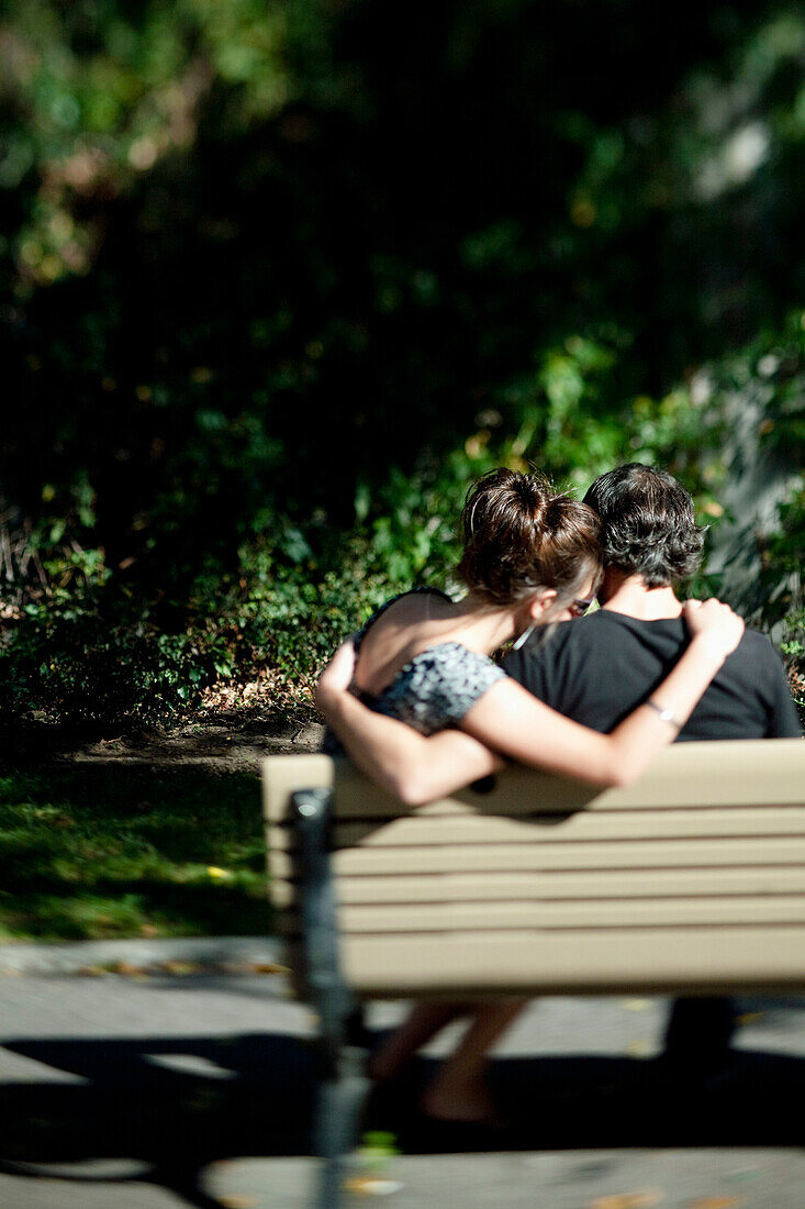 Couple of lovers sitting on a bench