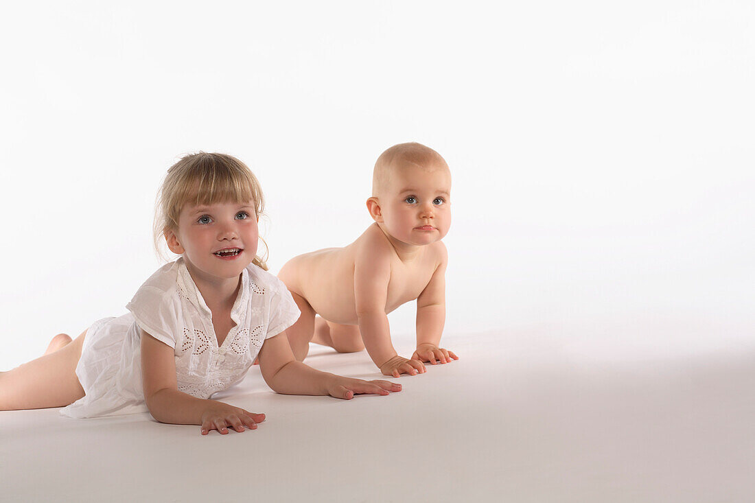 Girl and baby girl crawling