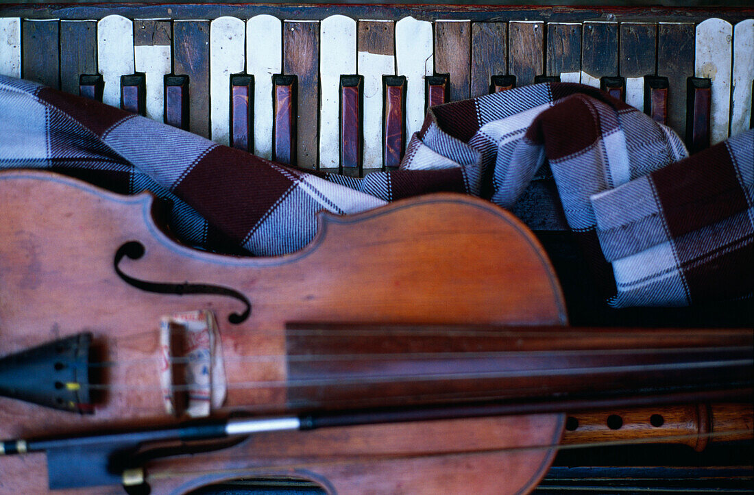 Keyboard, wooden flute and violin, close up, Nepal