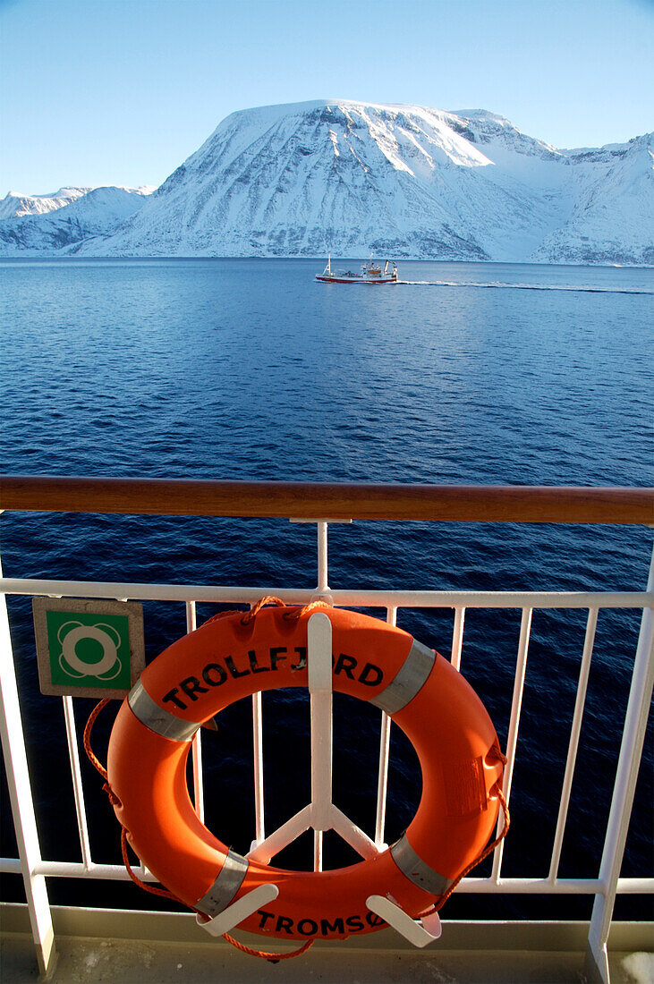 View of snowcapped mountains from ship, Norway
