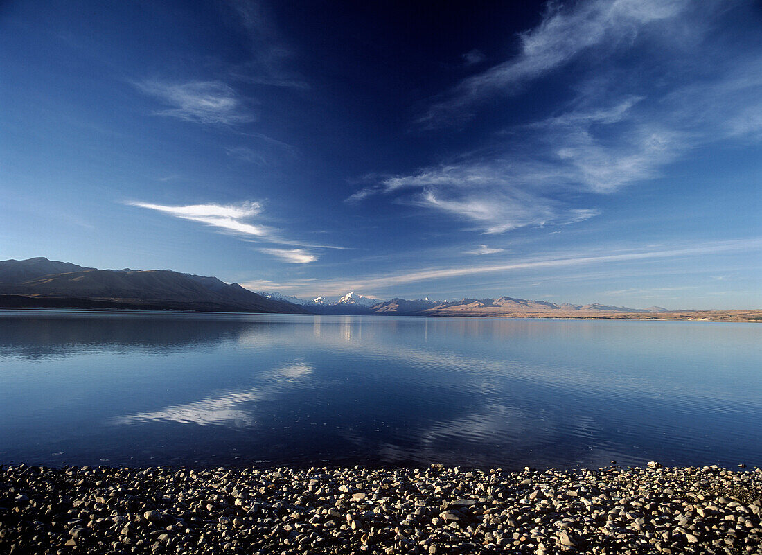 Looking across Lake Pukaki in early evening to Mt. Cook and Southern Alps, South Island, New Zealand