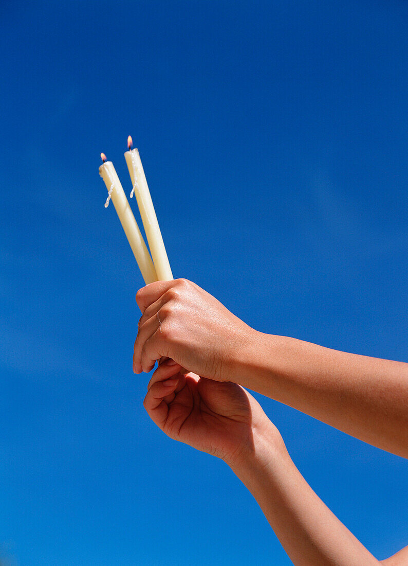 Woman holding candles as offerings, Fatima, Fatima, Portugal, © Ingrid Rasmussen / Axiom