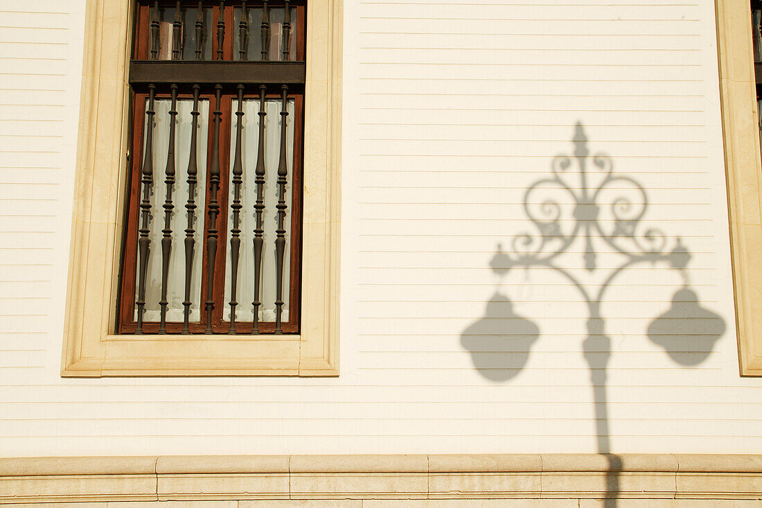 Window and street lamp shadow, Seville, Spain