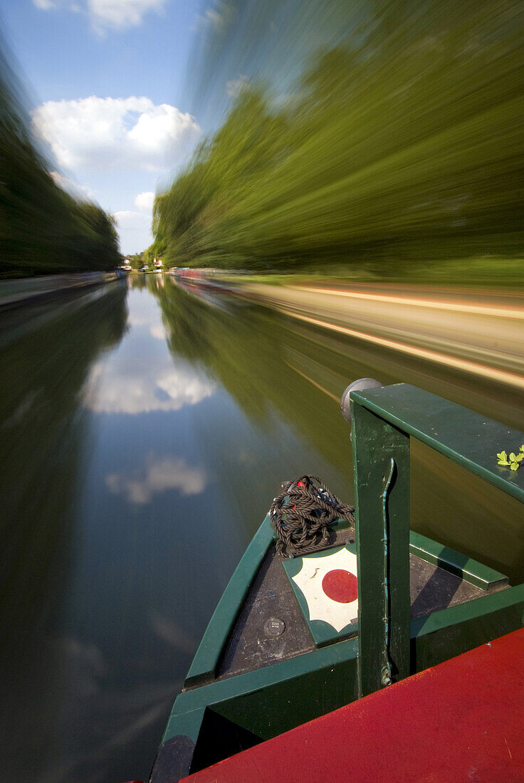 Canal boat going down the Grand Union Canal, Blurred Motion, Middlesex, England