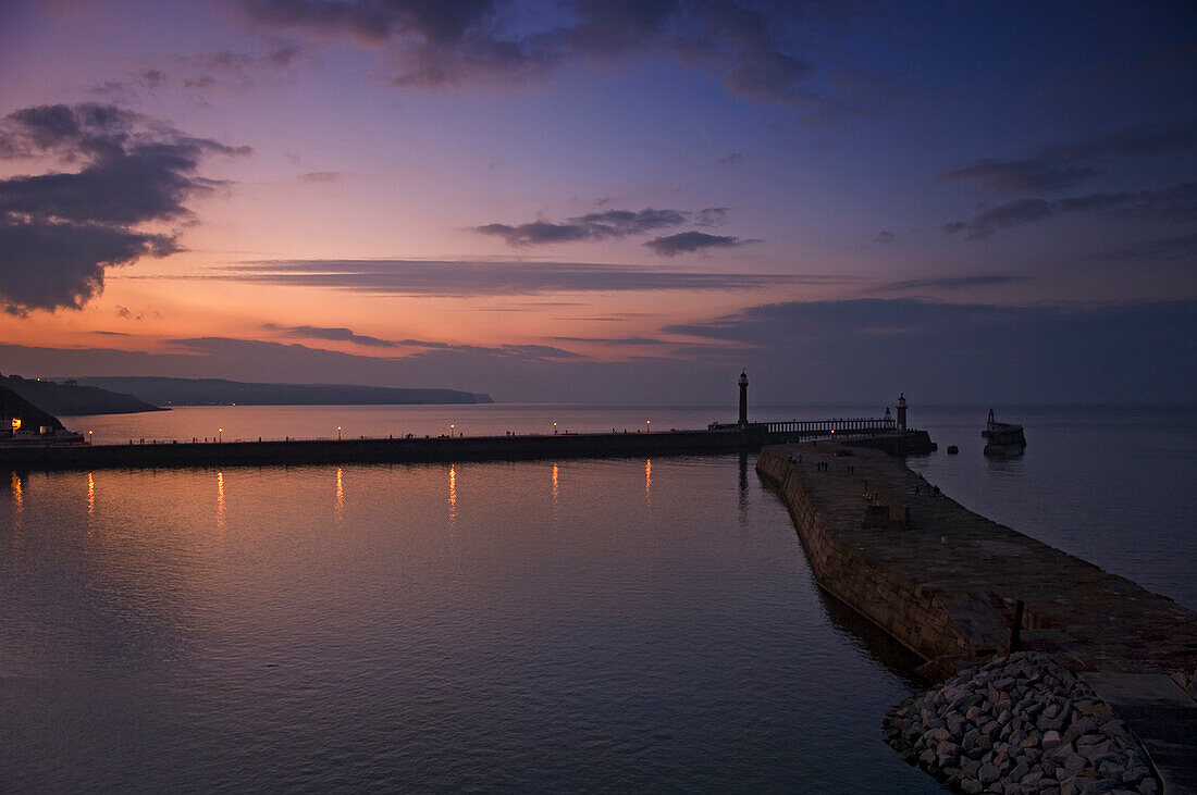 Pier at dusk in Whitby, North Yorkshire, UK