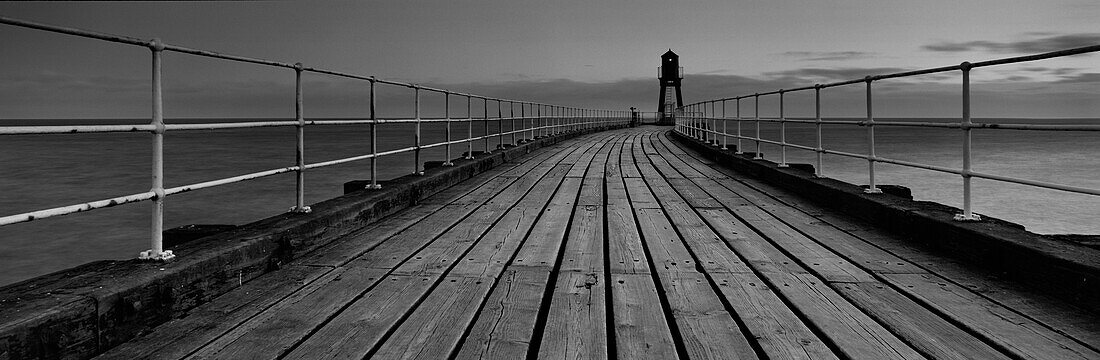 Whitby pier at dawn, North Yorkshire, England