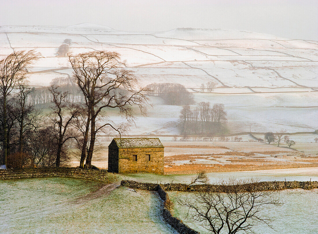Snowy landscape with barn, elevated view, Yorkshire, England