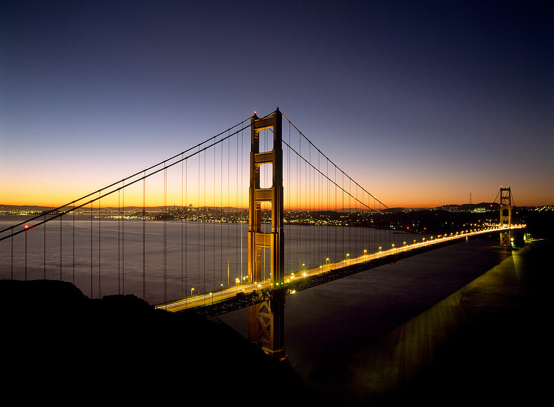 Looking across the Golden Gate Bridge at dawn with San Francisco behind, California