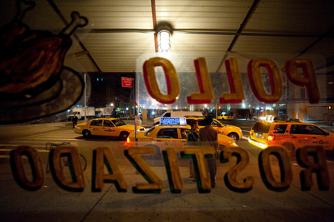 Taxis In The Street From A Mexican Restaurant In East Village, Manhattan, New York, USA