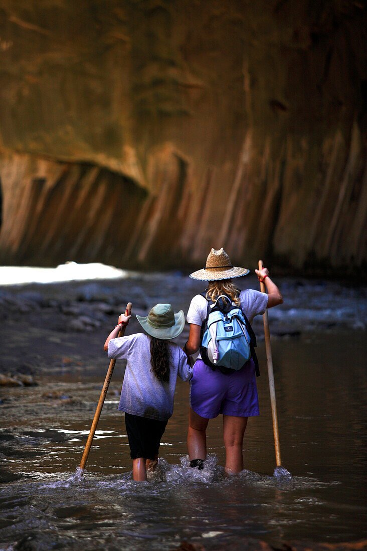 Hiking the Narrows at the Virgin River in Zion National Park, Zion National Park, Utah, USA.