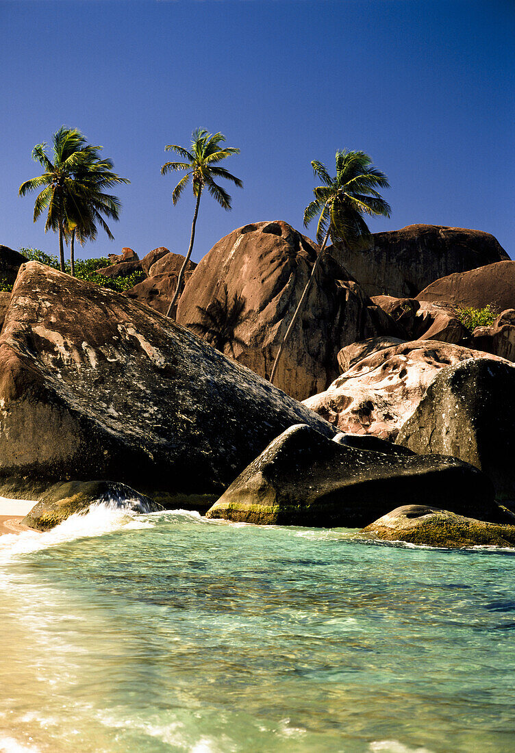 Boulders and palm trees on tropical beach, Baths, Virgin Gorda, British Virgin Island