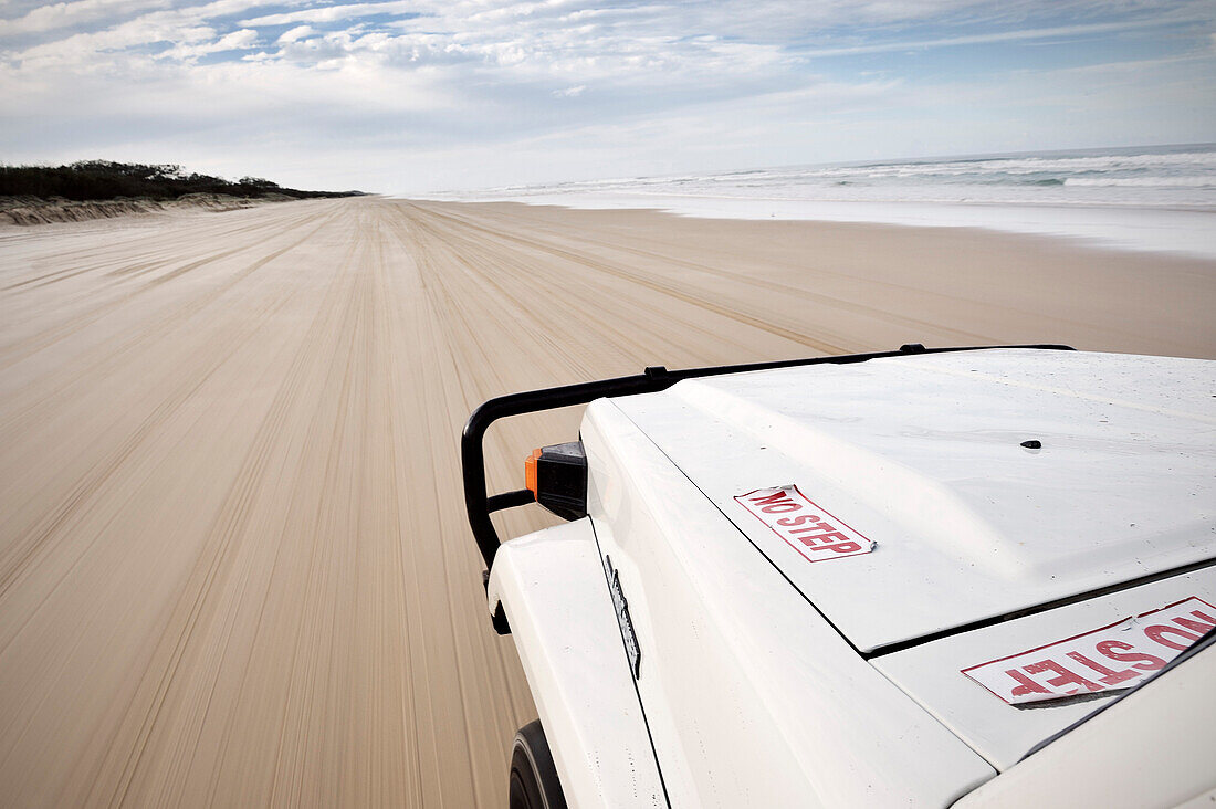 Self drive tour on Fraser Island along beach, offroad vehicle, UNESCO world heritage site, Queensland, Australia