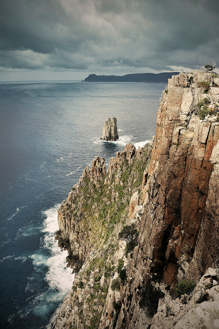 Rugged rocky coastline with cliffs at Cape Hauy, Tasman Peninsula, around Port Arthur, Tasmania, Australia