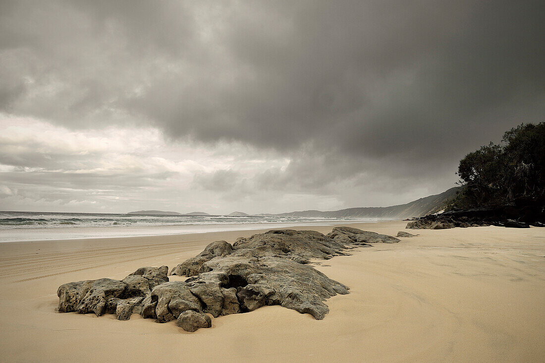 Beach with rocks, coastline, Rainbow Beach, Queensland, Australia