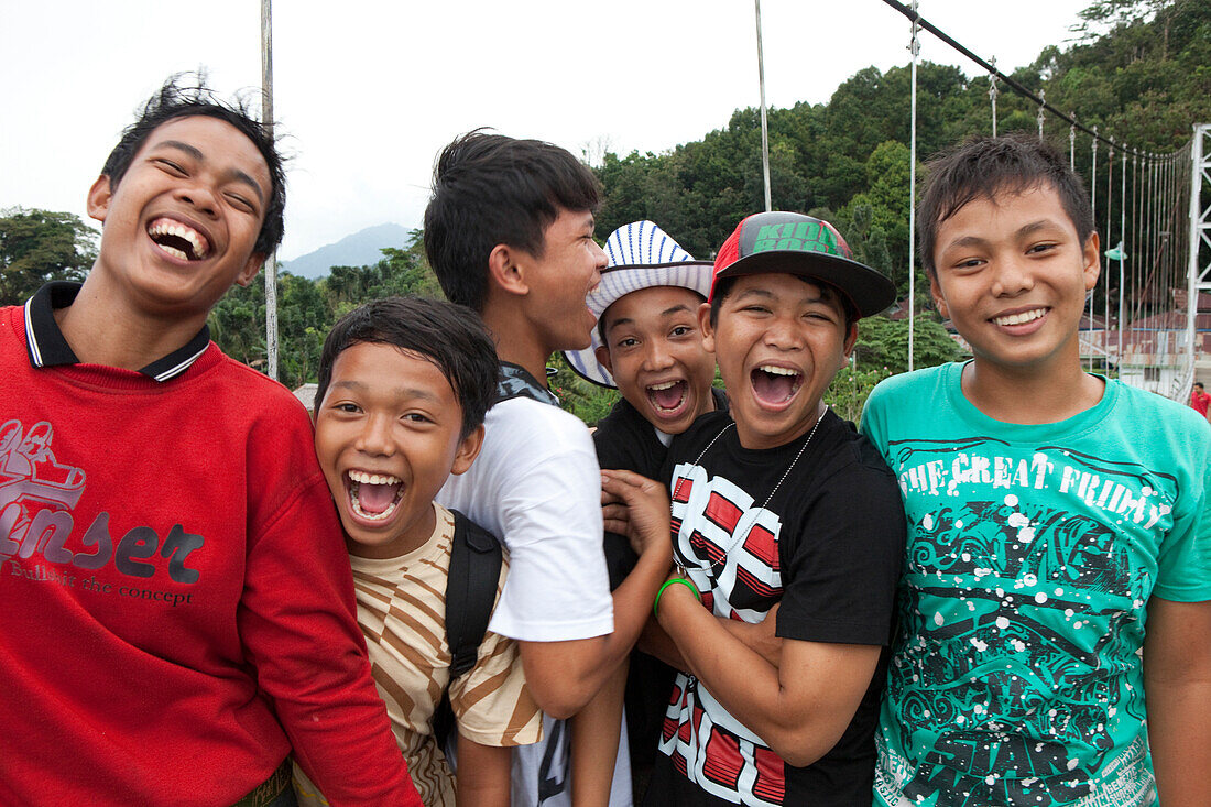 Indonesian teenagers in Bukit Lawang in North Sumatra province, Island of Sumatra, Indonesia, Southeast Asia