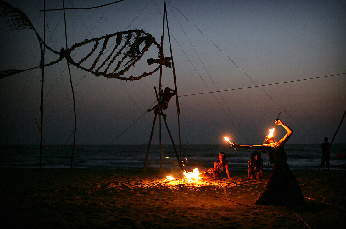 Fireworks on the beach at sunset, Arambol, Goa, India