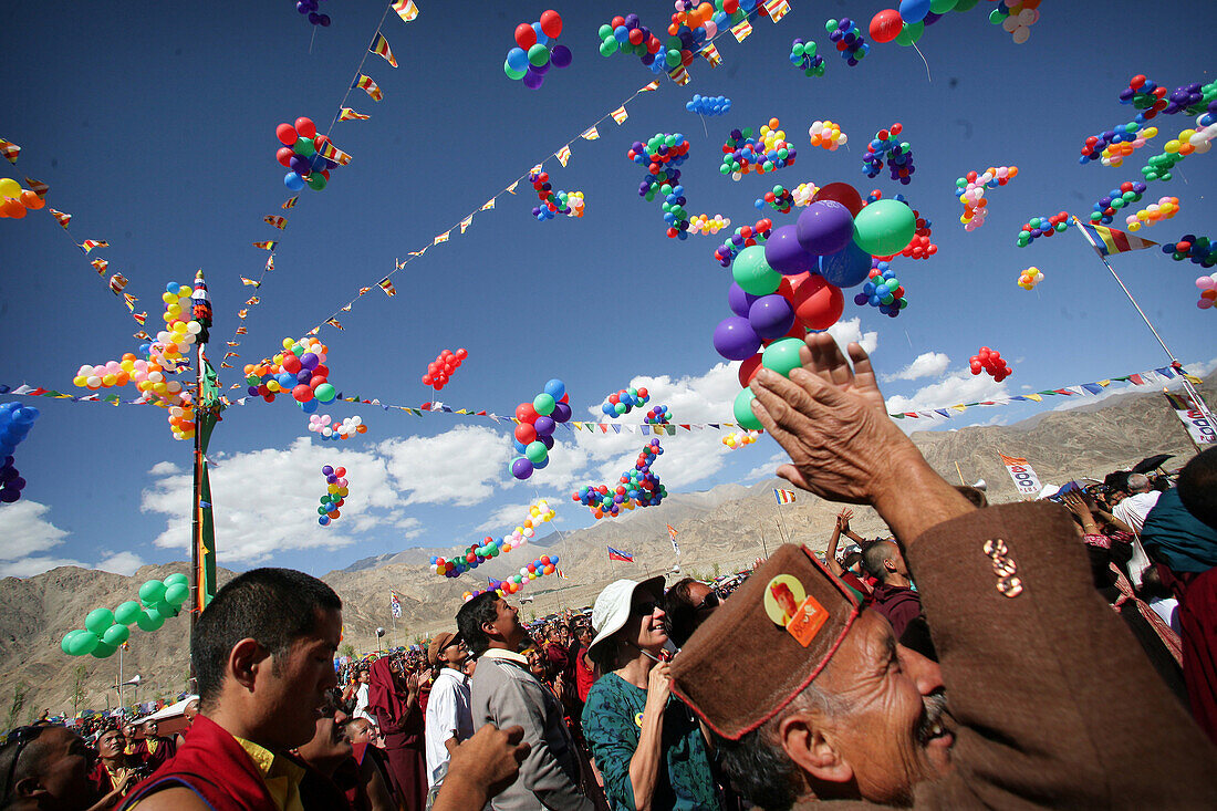 Monks with thousands of multi colored balloons at 800 year old birthday celebration / rituals of the Buddhist Drukpa Lineage, Naro Photang Shey, ( Shey Monastery ), Leh Ladakh, Indian Himalayas, India, Monks with thousands of multi coloured balloons at 80