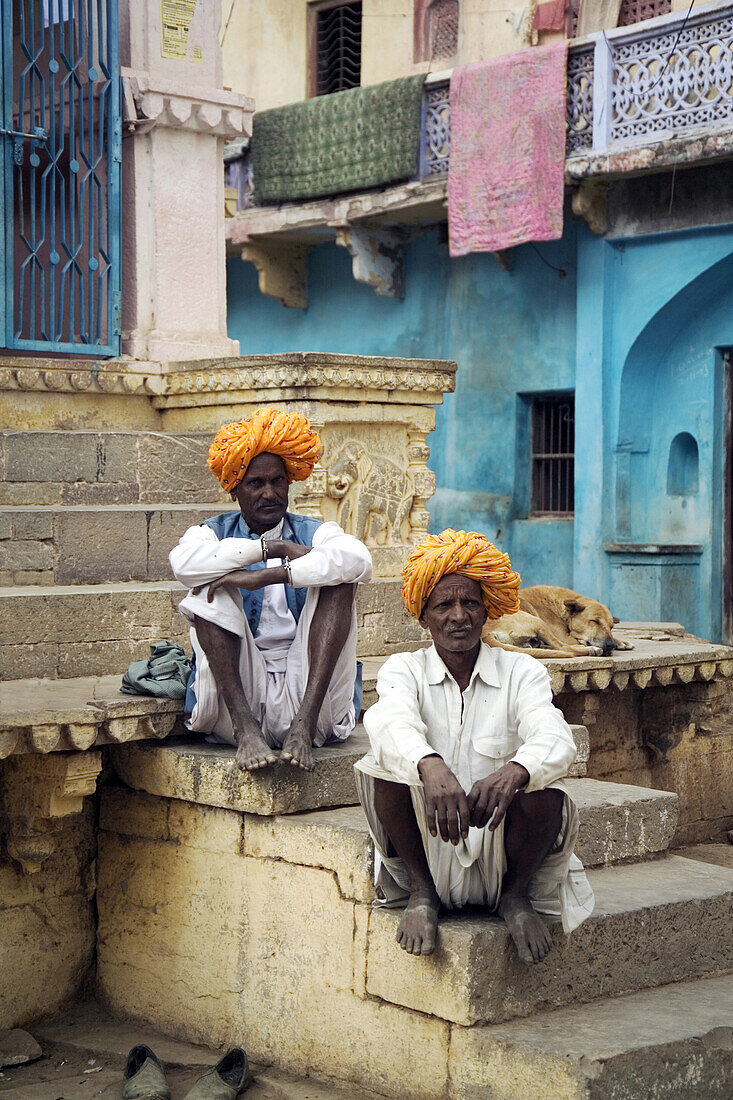 Two Rajput men sitting on steps in Bundi, Rajasthan, India