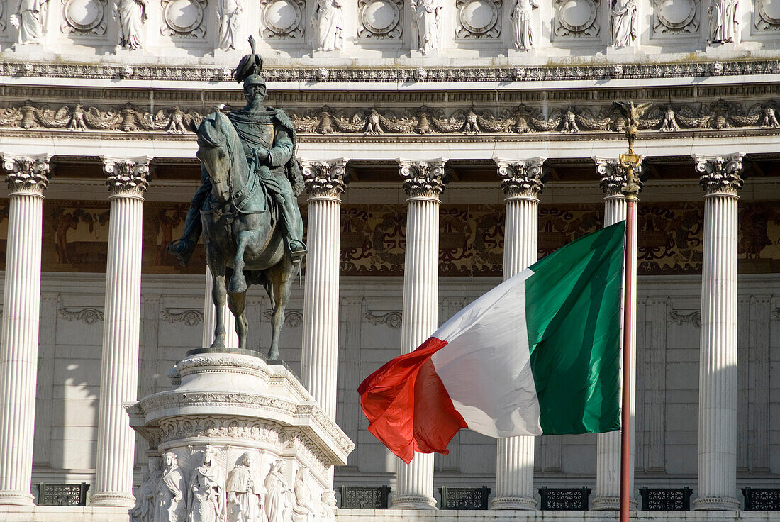 Statue and Italian Flag in front of  Vittorio Emanuele monument, Rome, Italy