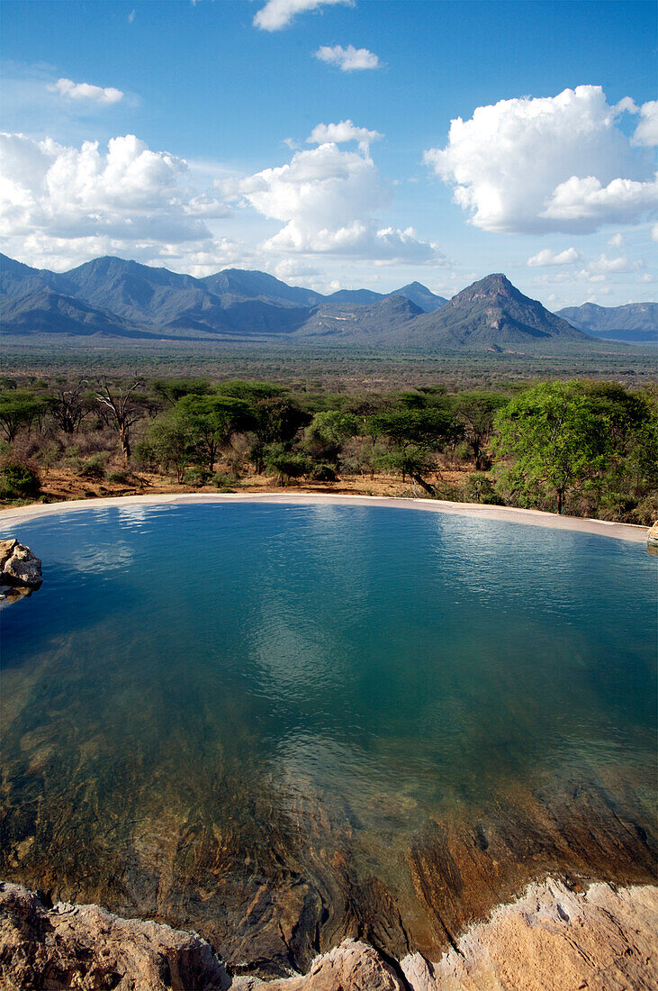 Empty infinity pool and grasslands, Namunyak, Matthews Mountains, Kenya