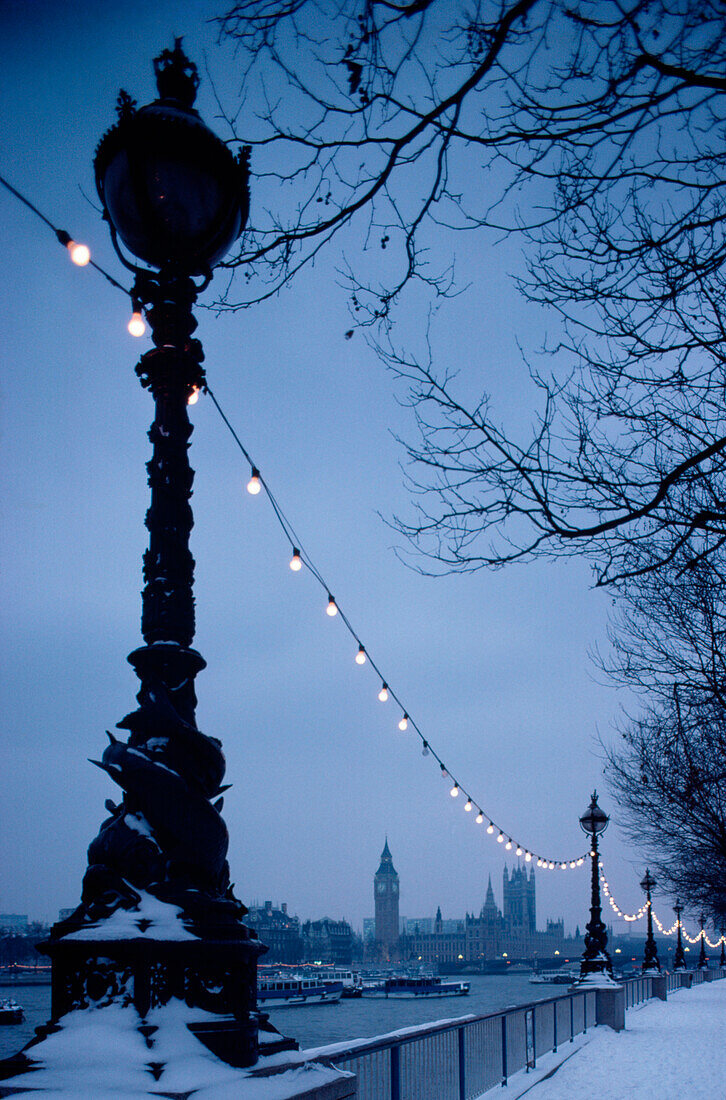 Houses of Parliament and lamp post in the snow, London, United Kingdom