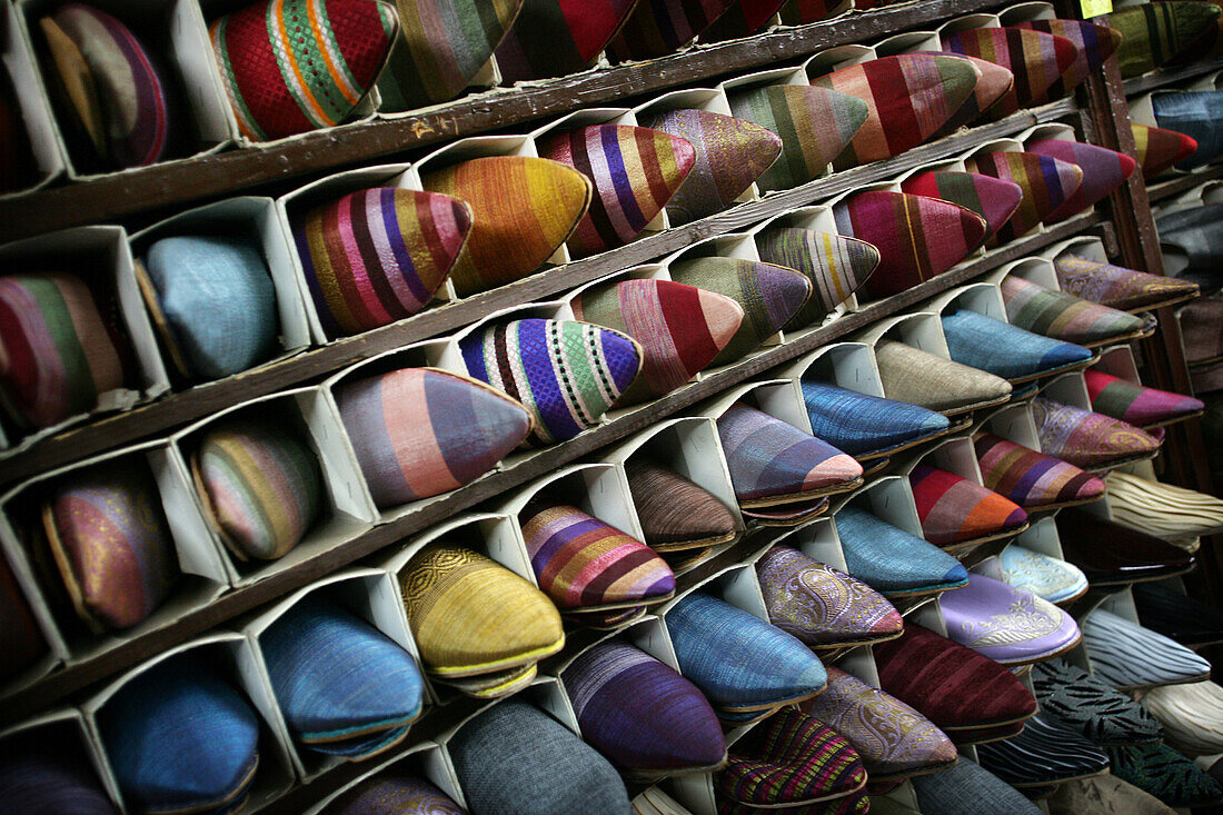 Colourful shoes for sale in the souk, Shopping in the medina, Marrakesh, Morocco.