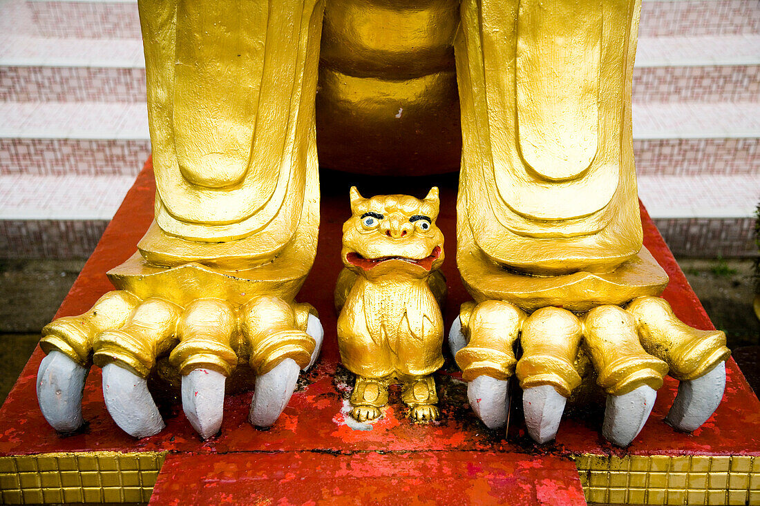 Golden lion guardians at entrance to Sam Poh Temple, Pahang, Malaysia
