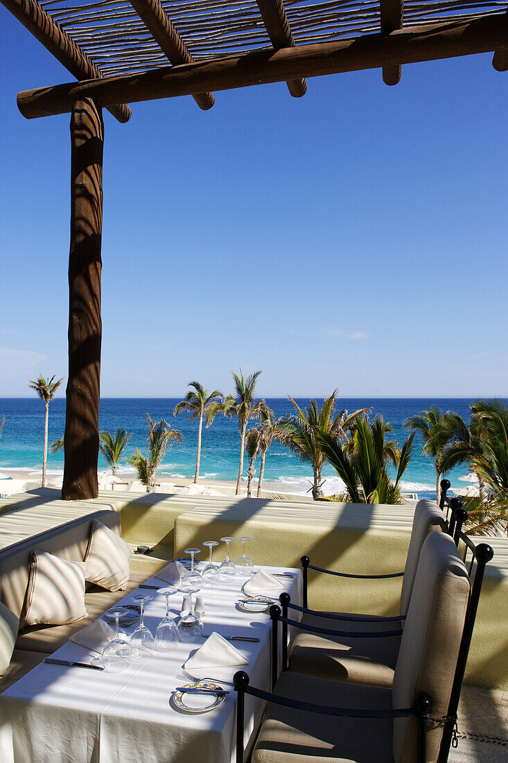 Dining tables by beach, Los Cabos, Mexico