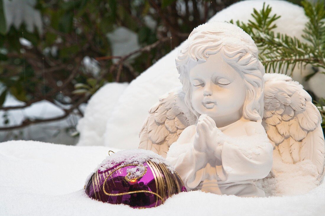 Praying angel in the snow