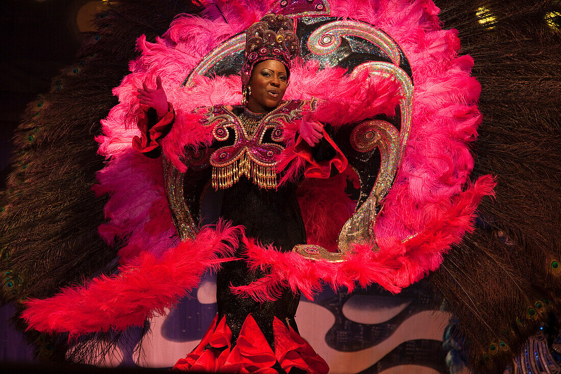 Woman wears colorful costume at folklore and samba dance show at Variete Plataforma 1, Rio de Janeiro, Rio de Janeiro, Brazil, South America