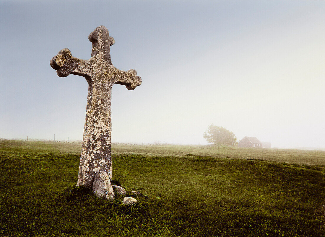 Stone cross in the fog, Oeland island, Sweden, Europe