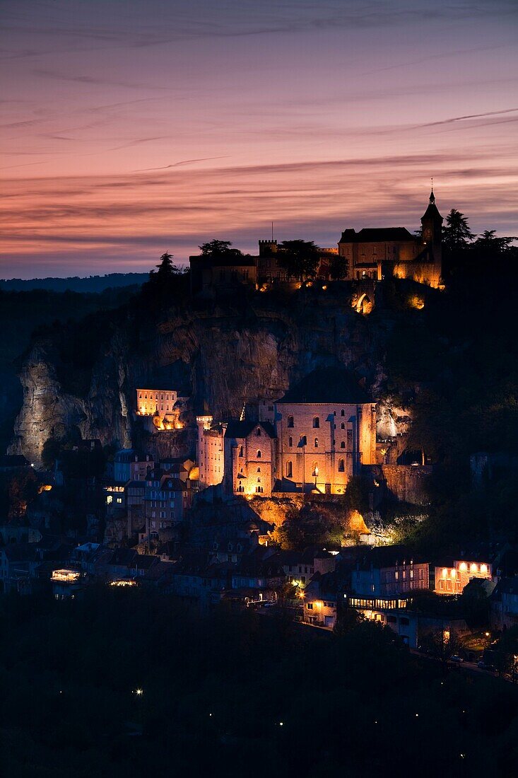 France, Midi-Pyrenees Region, Lot Department, Rocamadour, elevated town view, dusk