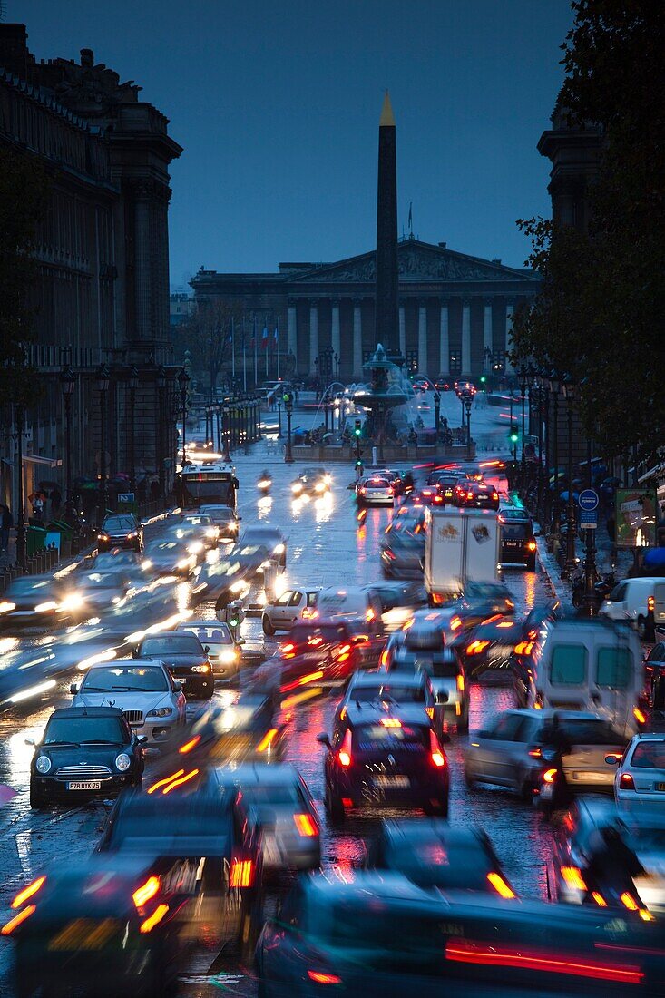 France, Paris, elevated view of evening traffic on rue Royale from Eglise Madeleine church